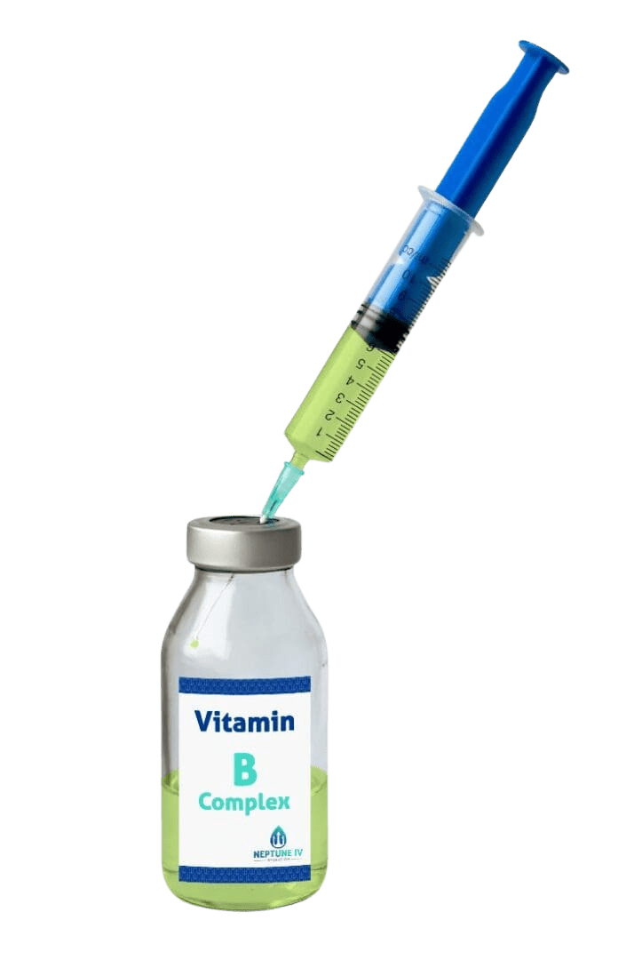 A syringe drawing a bright green liquid from a vial labeled "vitamin b complex" for mobile iv therapy.